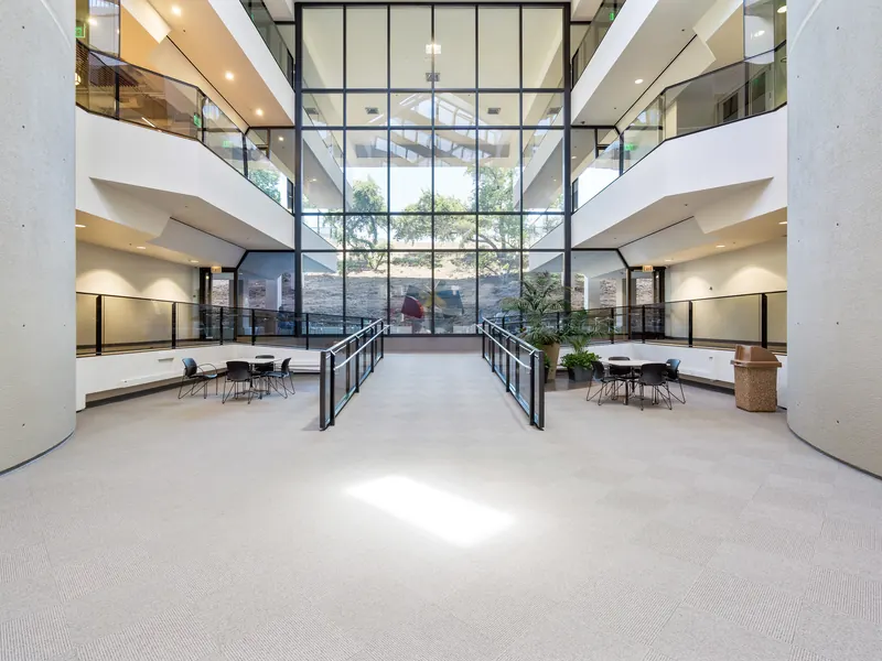 Glass atrium lobby filled with natural light