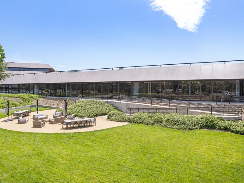 Outdoor lawn and seating area beside the building